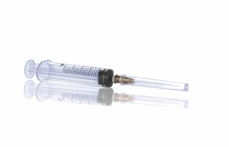 medical Syringe and needle isolated on a white background